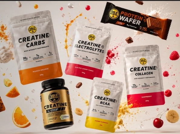Assorted Gold Nutrition creatine supplements in pouches and a bottle laid out on a white background with scattered fruit pieces and splashes of color.